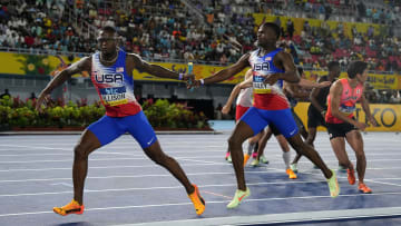 May 4, 2024; Nassau, Bahamas; Champ Allison takes the handoff from Christopher Bailey on the USA 4 x 400m relay during the World Athletics Relays at Thomas A. Robinson National Stadium. Mandatory Credit: Kirby Lee-USA TODAY Sports