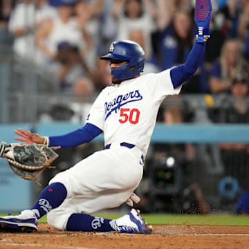 Seattle Mariners catcher Cal Raleigh tags out a runner during a game against the Los Angeles Dodgers on Aug. 20 at Dodger Stadium.