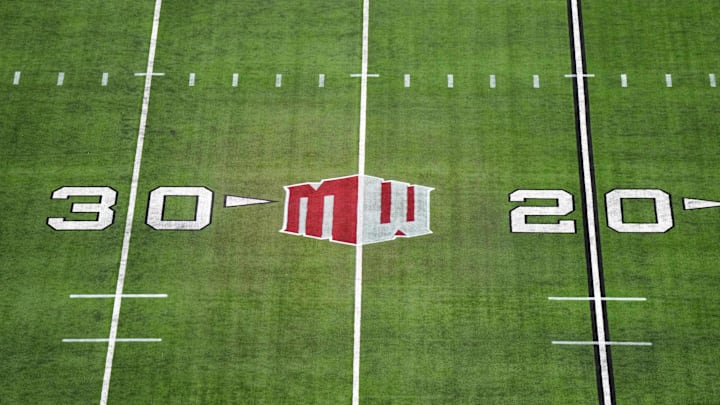 The Mountain West conference logo on the field at Allegiant Stadium. The Mountain West conference logo on the field at Allegiant Stadium.