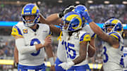 Los Angeles Rams wide receiver Demarcus Robinson (15) celebrates with quarterback Matthew Stafford (9) and running back Kyren Williams (23).