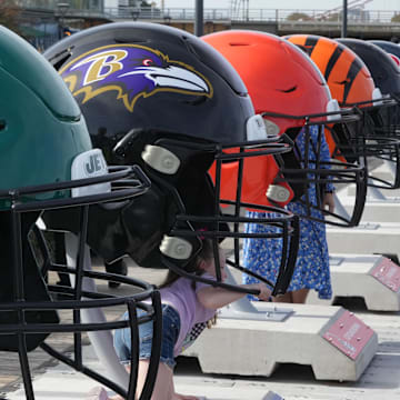 Oct 7, 2023; London, United Kingdom; Large oversized helmets of the New York Jets Baltimore Ravens, Cleveland Browns and Cincinnati Bengals at the NFL Experience London at the Battersea Power Station. Mandatory Credit: Kirby Lee-Imagn Images