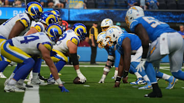 Aug 17, 2024; Inglewood, California, USA; A general overall view of the line of scrimmage as Los Angeles Rams center Mike McAllister (68) snaps the ball against Los Angeles Chargers defensive tackle Otito Ogbonnia (93) in the first half at SoFi Stadium. Mandatory Credit: Kirby Lee-Imagn Images