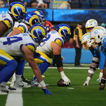 Aug 17, 2024; Inglewood, California, USA; A general overall view of the line of scrimmage as Los Angeles Rams center Mike McAllister (68) snaps the ball against Los Angeles Chargers defensive tackle Otito Ogbonnia (93) in the first half at SoFi Stadium. Mandatory Credit: Kirby Lee-Imagn Images