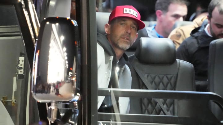 Feb 4, 2024; Las Vegas, NV, USA; San Francisco 49ers coach Kyle Shanahan watches from a team bus during Super Bowl 58 team arrivals at the Harry Reid International Airport. Mandatory Credit: Kirby Lee-USA TODAY Sports