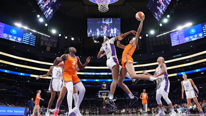Aug 7, 2025; Los Angeles, California, USA; Connecticut Sun center Olivia Nelson-Ododa (10) shoots the ball against LA Sparks forward Rickea Jackson (2) in the second half at the Crypto.com Arena.  Kirby Lee-Imagn Images