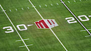 The Mountain West conference logo on the field at Allegiant Stadium. Mandatory Credit: Kirby Lee-Imagn Images