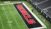 The UNLV Rebels logo in the end zone is seen before the Mountain West Championship between the Boise State Broncos and the UNLV Rebels at Allegiant Stadium. Mandatory Credit: Kirby Lee-Imagn Images