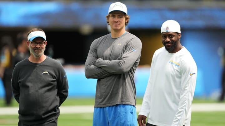 Aug 17, 2024; Inglewood, California, USA; Los Angeles Rams quarterbacks coach Shane Day (left), quarterback Justin Herbert (center) and linebackers coach Navorro Bowman during the game against the Los Angeles Rams at SoFi Stadium. Mandatory Credit: Kirby Lee-USA TODAY Sports