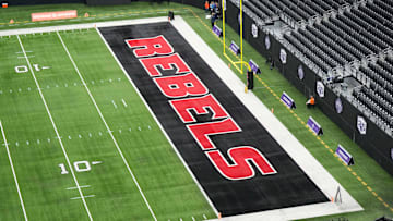 The UNLV Rebels logo in the end zone is seen before the Mountain West Championship between the Boise State Broncos and the UNLV Rebels at Allegiant Stadium. Mandatory Credit: Kirby Lee-Imagn Images