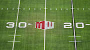 The Mountain West conference logo on the field at Allegiant Stadium. Mandatory Credit: Kirby Lee-Imagn Images