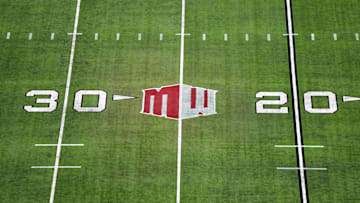 The Mountain West conference logo on the field at Allegiant Stadium. Mandatory Credit: Kirby Lee-Imagn Images