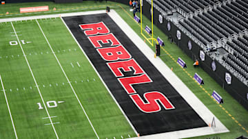 The UNLV Rebels logo in the end zone is seen before the Mountain West Championship between the Boise State Broncos and the UNLV Rebels at Allegiant Stadium. Mandatory Credit: Kirby Lee-Imagn Images