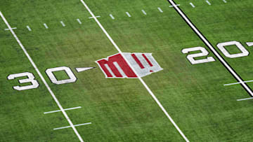 The Mountain West conference logo on the field at Allegiant Stadium. Mandatory Credit: Kirby Lee-Imagn Images