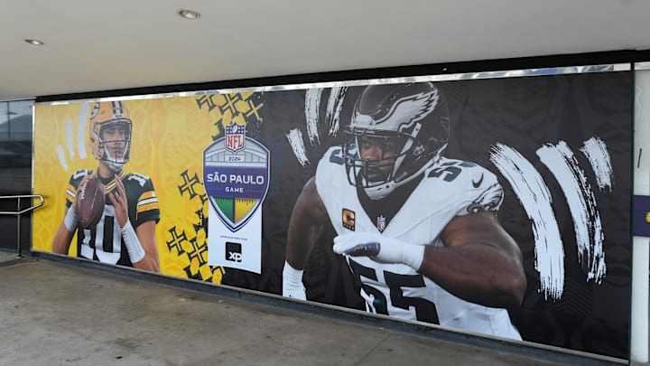 Signage with mages of Green Bay Packers quarterback Jordan Love and Philadelphia Eagles defensive end Brandon Graham