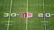 The Mountain West conference logo on the field at Allegiant Stadium. Mandatory Credit: Kirby Lee-Imagn Images