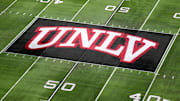 The UNLV Rebels logo at midfield during the Mountain West Championship at Allegiant Stadium. Mandatory Credit: Kirby Lee-Imagn Images