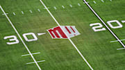 The Mountain West conference logo on the field at Allegiant Stadium. Mandatory Credit: Kirby Lee-Imagn Images
