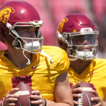 Apr 23, 2022; Los Angeles, CA, USA; Southern California Trojans quarterbacks Miller Moss (7) and Caleb Williams (13) throw the ball during the spring game at the Los Angeles Memorial Coliseum. Mandatory Credit: Kirby Lee-USA TODAY Sports