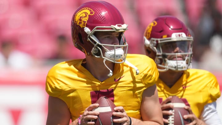 Apr 23, 2022; Los Angeles, CA, USA; Southern California Trojans quarterbacks Miller Moss (7) and Caleb Williams (13) throw the ball during the spring game at the Los Angeles Memorial Coliseum. Mandatory Credit: Kirby Lee-USA TODAY Sports