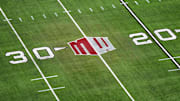 The Mountain West conference logo on the field at Allegiant Stadium. Mandatory Credit: Kirby Lee-Imagn Images