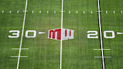 The Mountain West conference logo on the field at Allegiant Stadium. Mandatory Credit: Kirby Lee-Imagn Images