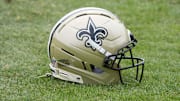 Aug 14, 2025; Carson, CA, USA; A New Orleans Saints helmet on the field during a joint practice against the Los Angeles Rams at the Dignity Health Sports Park. Mandatory Credit: Kirby Lee-Imagn Images