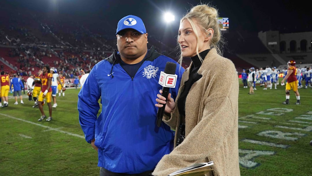 Nov 27, 2021; Los Angeles, California, USA; BYU Cougars head coach Kalani Sitake is interviewed by ESPN sideline reporter Stormy Buonantony after the game against the Southern California Trojansin the second half at United Airlines Field at Los Angeles Memorial Coliseum. Mandatory Credit: Kirby Lee-Imagn Images