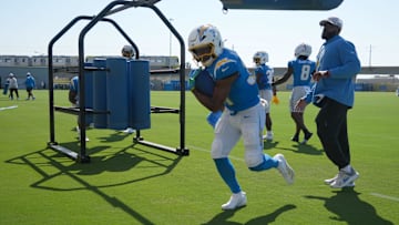 Aug 7, 2025; El Segundo, CA, USA; Los Angeles Chargers running back Raheim Sanders (35) interacts with running backs coach Kiel McDonald during training camp at The Bolt. Mandatory Credit: Kirby Lee-Imagn Images