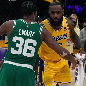 Boston Celtics guard Marcus Smart (36) and Los Angeles Lakers forward LeBron James (6) embrace after the game at Staples Center. The Lakers defeated the Celtics 117-102.  Mandatory Credit: