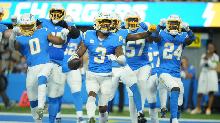 Oct 29, 2023; Inglewood, California, USA; Los Angeles Chargers safety Derwin James Jr. (3) celebrates with linebacker Daiyan Henley (0) and safety AJ Finley (24) after intercepting a pass against the Chicago Bears in the second half at SoFi Stadium. Mandatory Credit: Kirby Lee-USA TODAY Sports