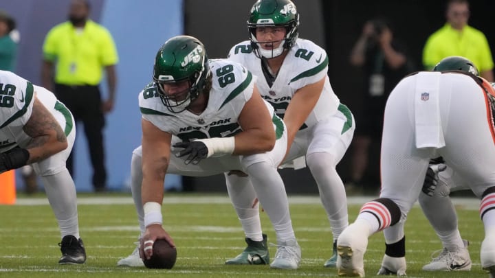 Aug 3, 2023; Canton, Ohio, USA; New York Jets quarterback Zach Wilson (2) takes the snap from center Joe Tippmann (66) against the Cleveland Browns during the first half at Tom Benson Hall of Fame Stadium. 