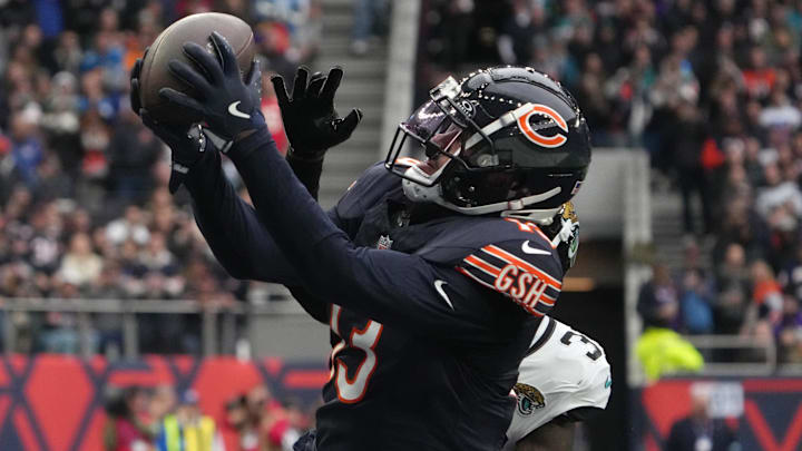 Oct 13, 2024; London, United Kingdom; Chicago Bears wide receiver Keenan Allen (13) catches a three-yard touchdown pass against Jacksonville Jaguars cornerback Montaric Brown (30) in the second half during an NFL International Series game at Tottenham Hotspur Stadium. Mandatory Credit: Kirby Lee-Imagn Images
