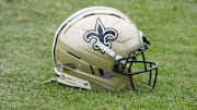 Aug 14, 2025; Carson, CA, USA; A New Orleans Saints helmet on the field during a joint practice against the Los Angeles Rams at the Dignity Health Sports Park. Mandatory Credit: Kirby Lee-Imagn Images