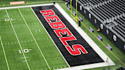 The UNLV Rebels logo in the end zone is seen before the Mountain West Championship between the Boise State Broncos and the UNLV Rebels at Allegiant Stadium. Mandatory Credit: Kirby Lee-Imagn Images