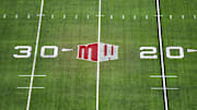 The Mountain West conference logo on the field at Allegiant Stadium. Mandatory Credit: Kirby Lee-Imagn Images