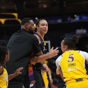 Sep 17, 2024; Los Angeles, California, USA; Phoenix Mercury center Brittney Griner (42) is restrained by Khary Stanley from LA Sparks forward Rickea Jackson (2) in the first half at Crypto.com Arena. Mandatory Credit: Kirby Lee-Imagn Images