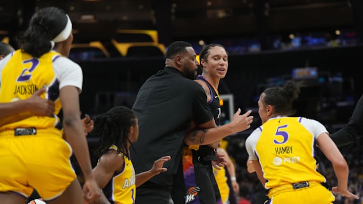 Sep 17, 2024; Los Angeles, California, USA; Phoenix Mercury center Brittney Griner (42) is restrained by Khary Stanley from LA Sparks forward Rickea Jackson (2) in the first half at Crypto.com Arena. Mandatory Credit: Kirby Lee-Imagn Images