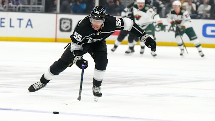 Apr 15, 2024; Los Angeles, California, USA; LA Kings right wing Quinton Byfield (55) skates with the puck against the Minnesota Wild in the second period at Crypto.com Arena. Mandatory Credit: Kirby Lee-Imagn Images