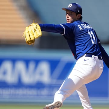 Aug 8, 2025; Los Angeles, California, USA; Los Angeles Dodgers pitcher Roki Sasaki (11) throws before the game against the Toronto Blue Jays at Dodger Stadium. Mandatory Credit: Kirby Lee-Imagn Images