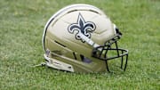 Aug 14, 2025; Carson, CA, USA; A New Orleans Saints helmet on the field during a joint practice against the Los Angeles Rams at the Dignity Health Sports Park. Mandatory Credit: Kirby Lee-Imagn Images