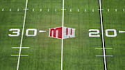 The Mountain West conference logo on the field at Allegiant Stadium. Mandatory Credit: Kirby Lee-Imagn Images