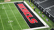 Dec 2, 2023; Las Vegas, NV, USA; The UNLV Rebels logo in the end zone is seen before the Mountain West Championship between the Boise State Broncos and the UNLV Rebels at Allegiant Stadium. Mandatory Credit: Kirby Lee-Imagn Images