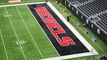 The UNLV Rebels logo in the end zone is seen before the Mountain West Championship between the Boise State Broncos and the UNLV Rebels at Allegiant Stadium. Mandatory Credit: Kirby Lee-Imagn Images