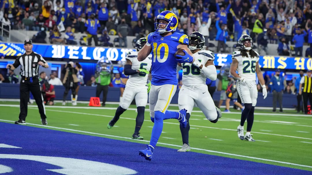 Dec 21, 2021; Inglewood, California, USA; Los Angeles Rams wide receiver Cooper Kupp (10) celebrates after scoring on a 29-yard touchdown reception against the Seattle Seahawks in the second half at SoFi Stadium. The Rams defeated the Seahawks 20-10. Mandatory Credit: Kirby Lee-Imagn Images