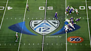 Dec 1, 2023; Las Vegas, NV, USA; A general overall view as Washington Huskies quarterback Michael Penix Jr. (9)] throws the ball at midfield on the Pac-12 Conference logo against the Oregon Ducks in the first half at Allegiant Stadium. Mandatory Credit: Kirby Lee-USA TODAY Sports