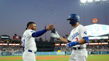 Jun 14, 2024; Los Angeles, California, USA; Los Angeles Dodgers left fielder Chris Taylor (3) is congratulated by right fielder Teoscar Hernandez (37) after hitting a two-run home run in the fifth inning against the Kansas City Royals at Dodger Stadium. Mandatory Credit: Kirby Lee-USA TODAY Sports