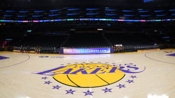 Apr 9, 2024; Los Angeles, California, USA; THe Los Angeles Lakers logo at midcourt Crypto.com Arena. Mandatory Credit: Kirby Lee-USA TODAY Sports