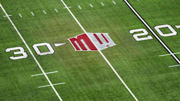 The Mountain West conference logo on the field at Allegiant Stadium. Mandatory Credit: Kirby Lee-Imagn Images