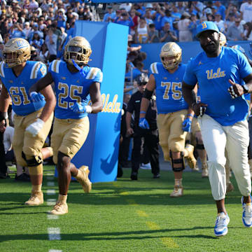 Sep 14, 2024; Pasadena, California, USA; UCLA Bruins head coach DeShaun Foster enters the field before the game against the Indiana Hoosiers at Rose Bowl. Mandatory Credit: Kirby Lee-Imagn Images