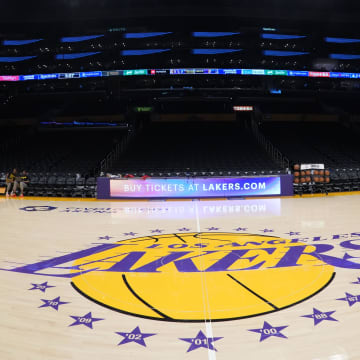 Apr 9, 2024; Los Angeles, California, USA; THe Los Angeles Lakers logo at midcourt Crypto.com Arena. Mandatory Credit: Kirby Lee-USA TODAY Sports